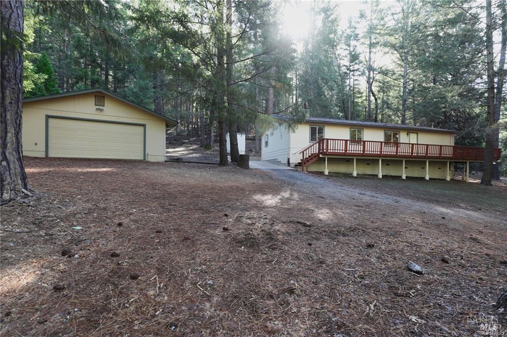 9356 Rockys Road Kelseyville, CA 95451 - Photo 3 of 24 a view of a house with a yard and a large tree
