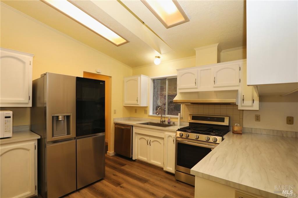 9356 Rockys Road Kelseyville, CA 95451 - Photo 10 of 24 a kitchen with cabinets and steel stainless steel appliances