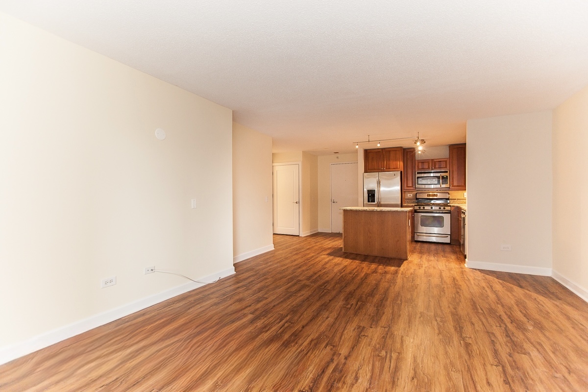 545 North Dearborn Street, Unit 902 Chicago, IL 60654 - Photo 4 of 16 a view of a room with wooden floor
