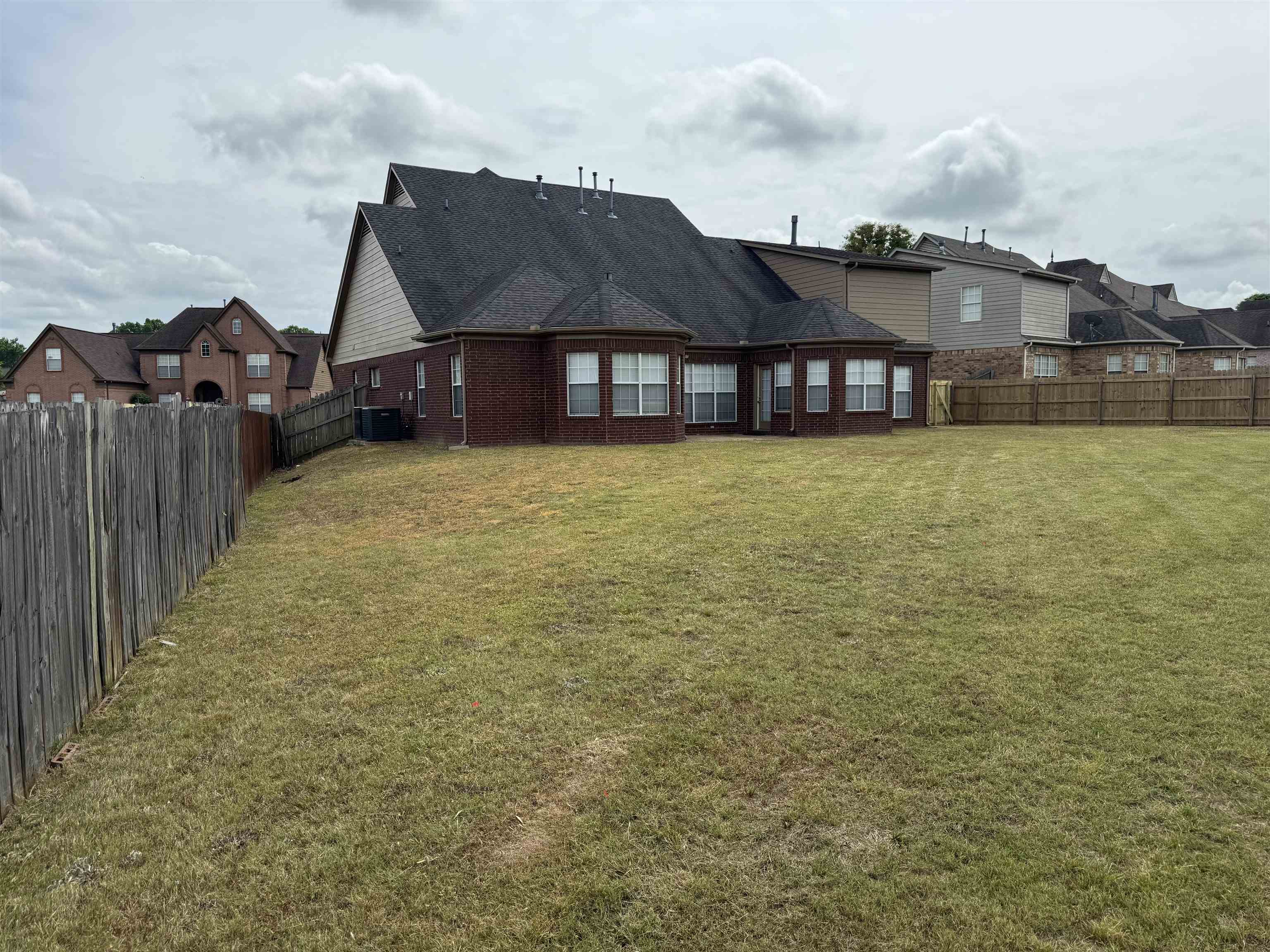 5393 Hightor Lane Memphis, TN 38125 - Photo 2 of 28 a front view of a house with a big yard