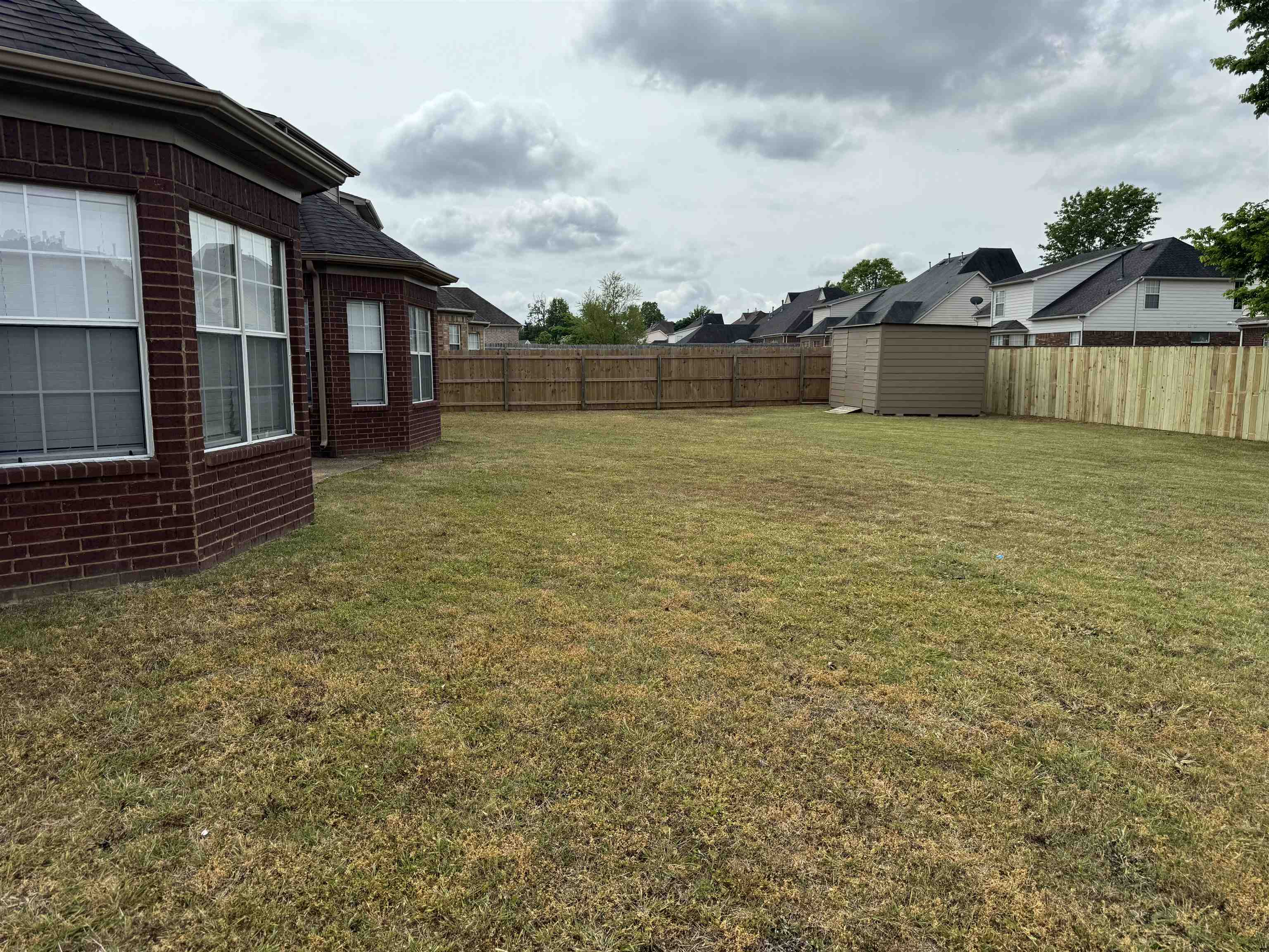 5393 Hightor Lane Memphis, TN 38125 - Photo 3 of 28 a front view of a house with a yard