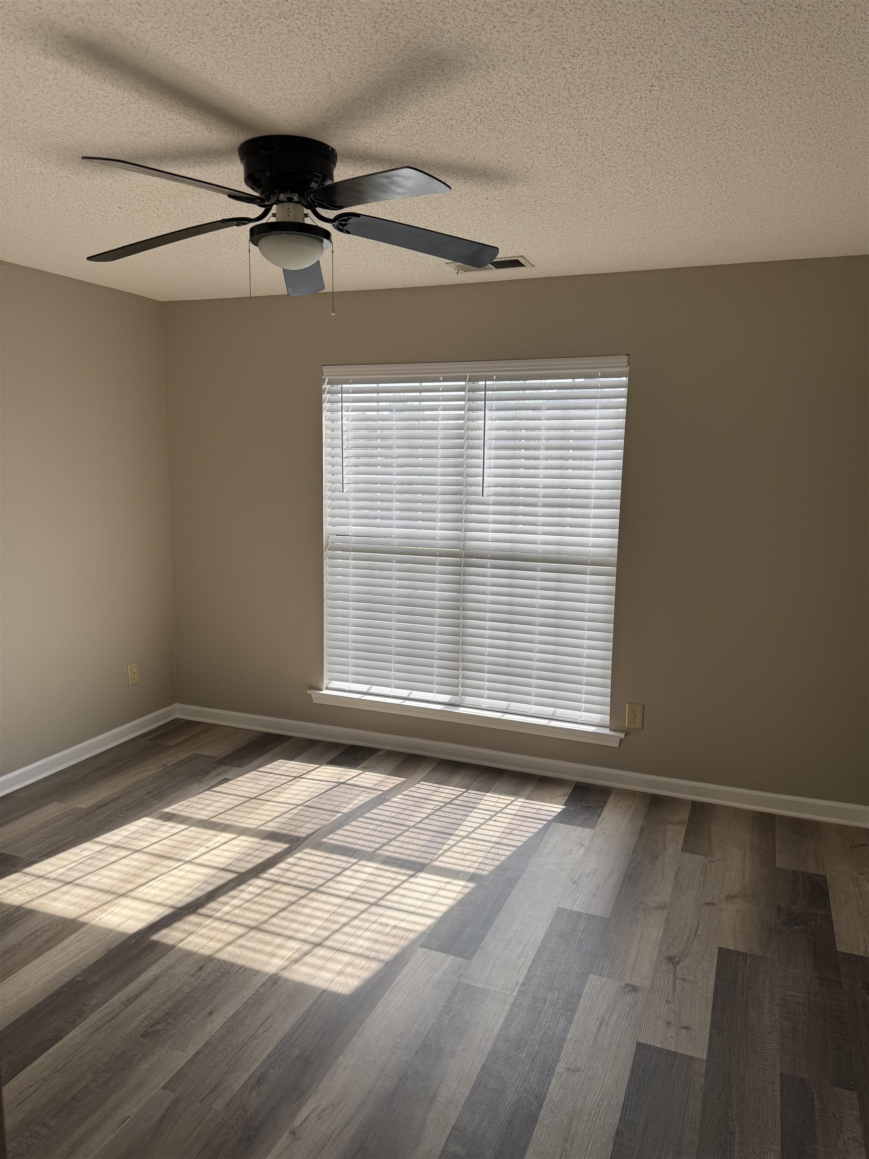 5393 Hightor Lane Memphis, TN 38125 - Photo 9 of 28 a view of empty room with wooden floor and fan