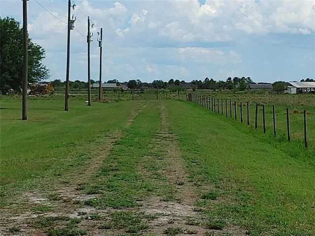 a view of a lake with a big yard