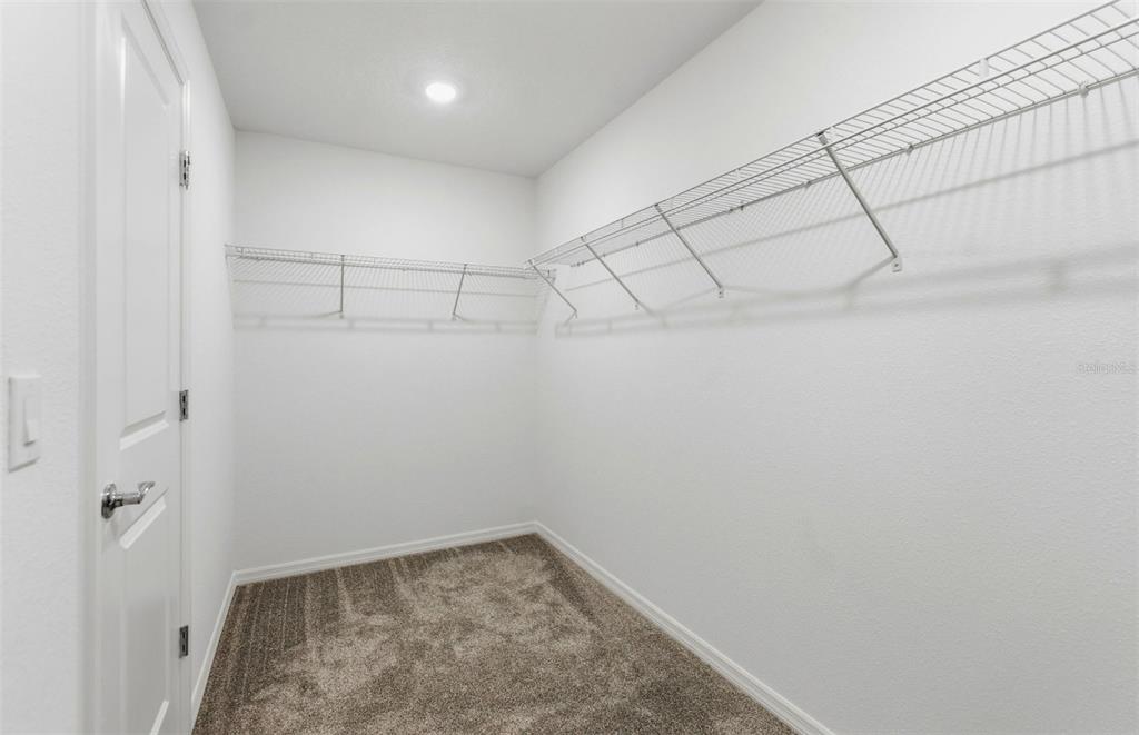 1448 Hamilton Way Lake Alfred, FL 33850 - Photo 13 of 32 a view of a room with racks on the wall