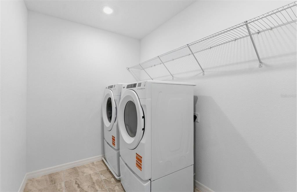 1448 Hamilton Way Lake Alfred, FL 33850 - Photo 17 of 32 a utility room with dryer and washer