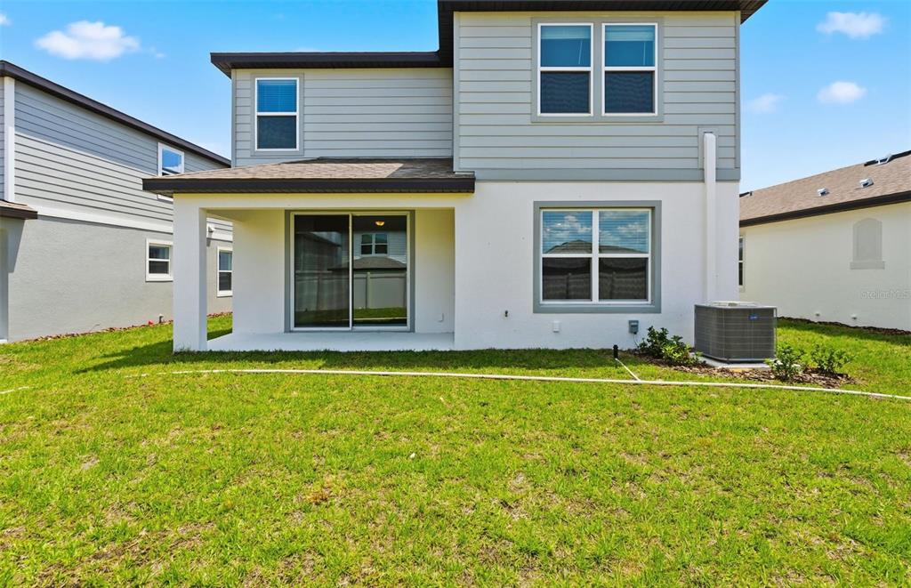 1448 Hamilton Way Lake Alfred, FL 33850 - Photo 18 of 32 a view of a house with backyard and sitting area