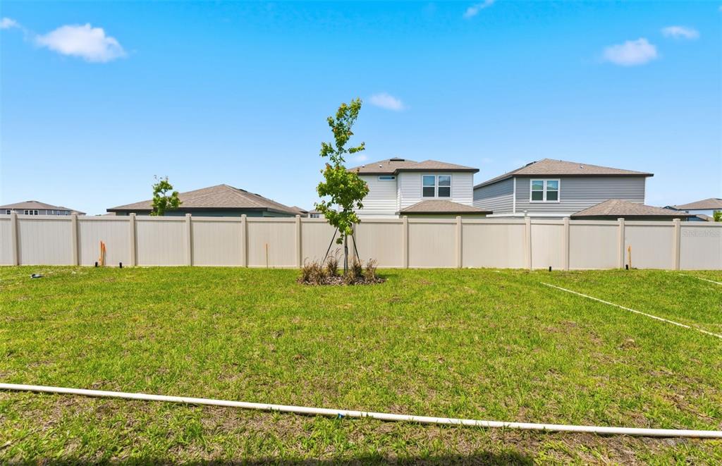 1448 Hamilton Way Lake Alfred, FL 33850 - Photo 19 of 32 a front view of a house with garden