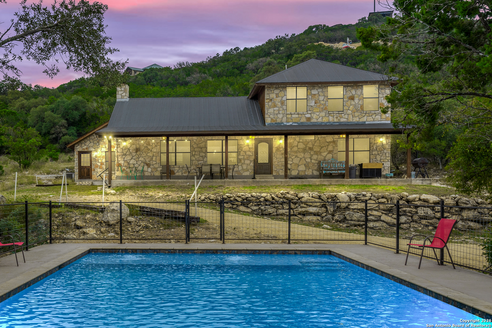 a view of a house with wooden floor and a yard