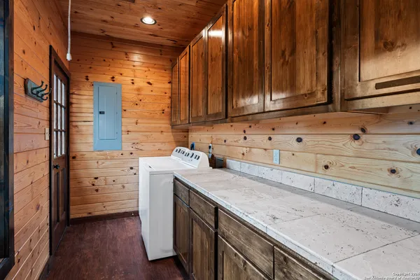 a kitchen with granite countertop cabinets and sink