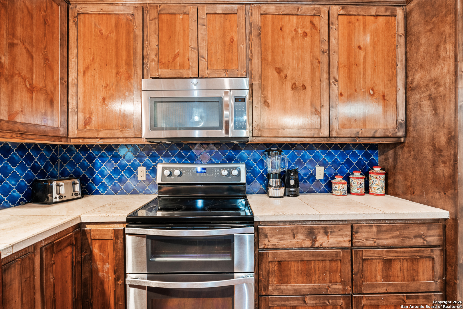 1539 River Road Concan, TX 78838 - Photo 19 of 45 a kitchen with a stove and a microwave