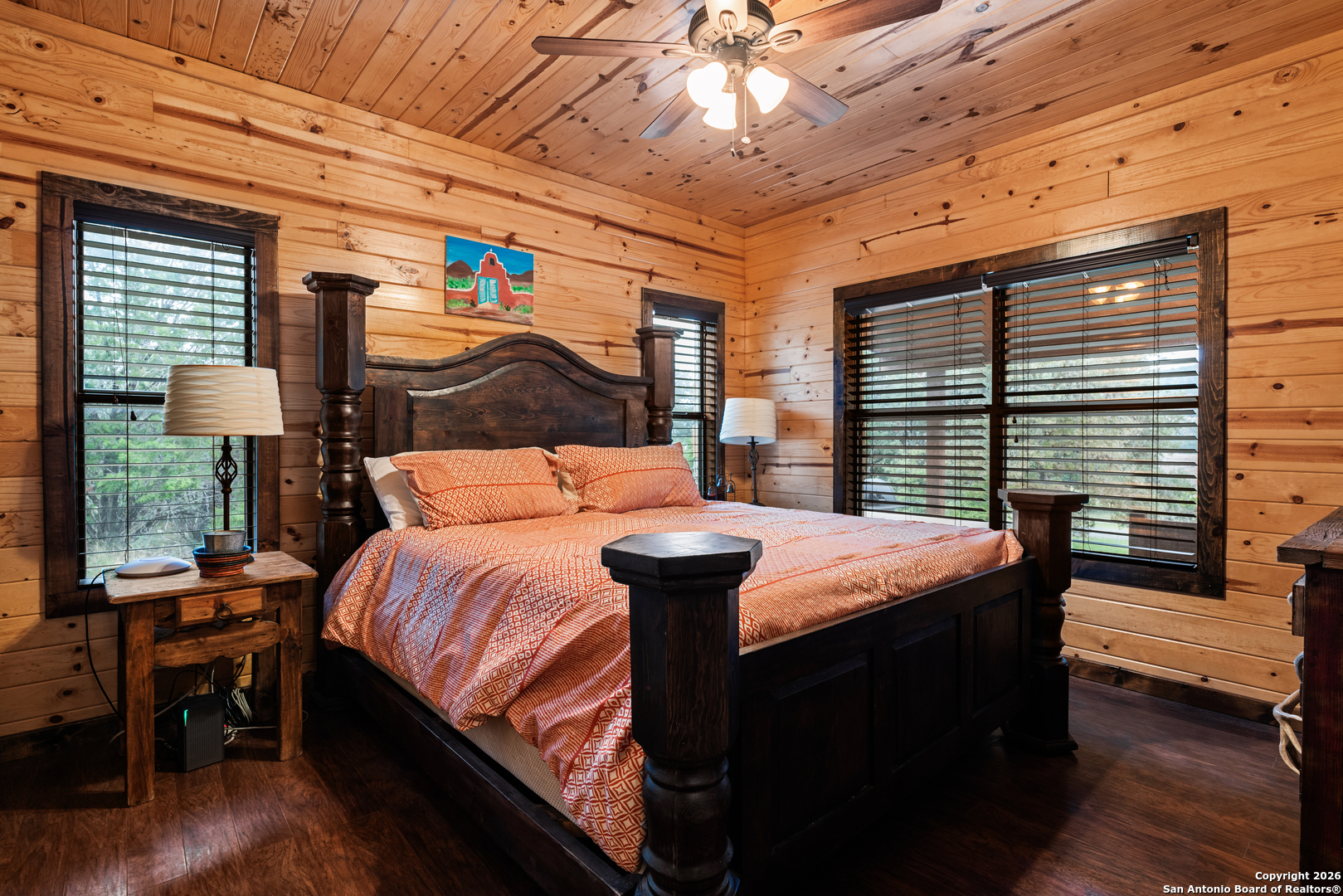 1539 River Road Concan, TX 78838 - Photo 21 of 45 a bedroom with bed and wooden floor