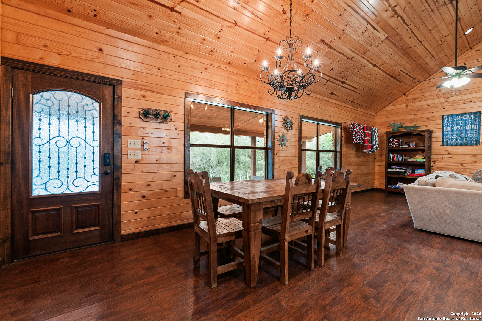 1539 River Road Concan, TX 78838 - Photo 27 of 45 a view of a dining room with furniture window and wooden floor