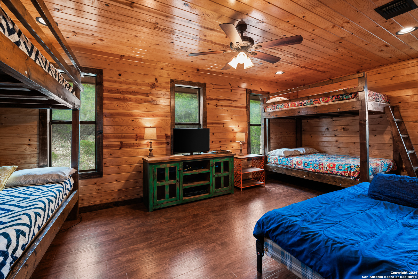 1539 River Road Concan, TX 78838 - Photo 28 of 45 a bedroom with furniture and a window