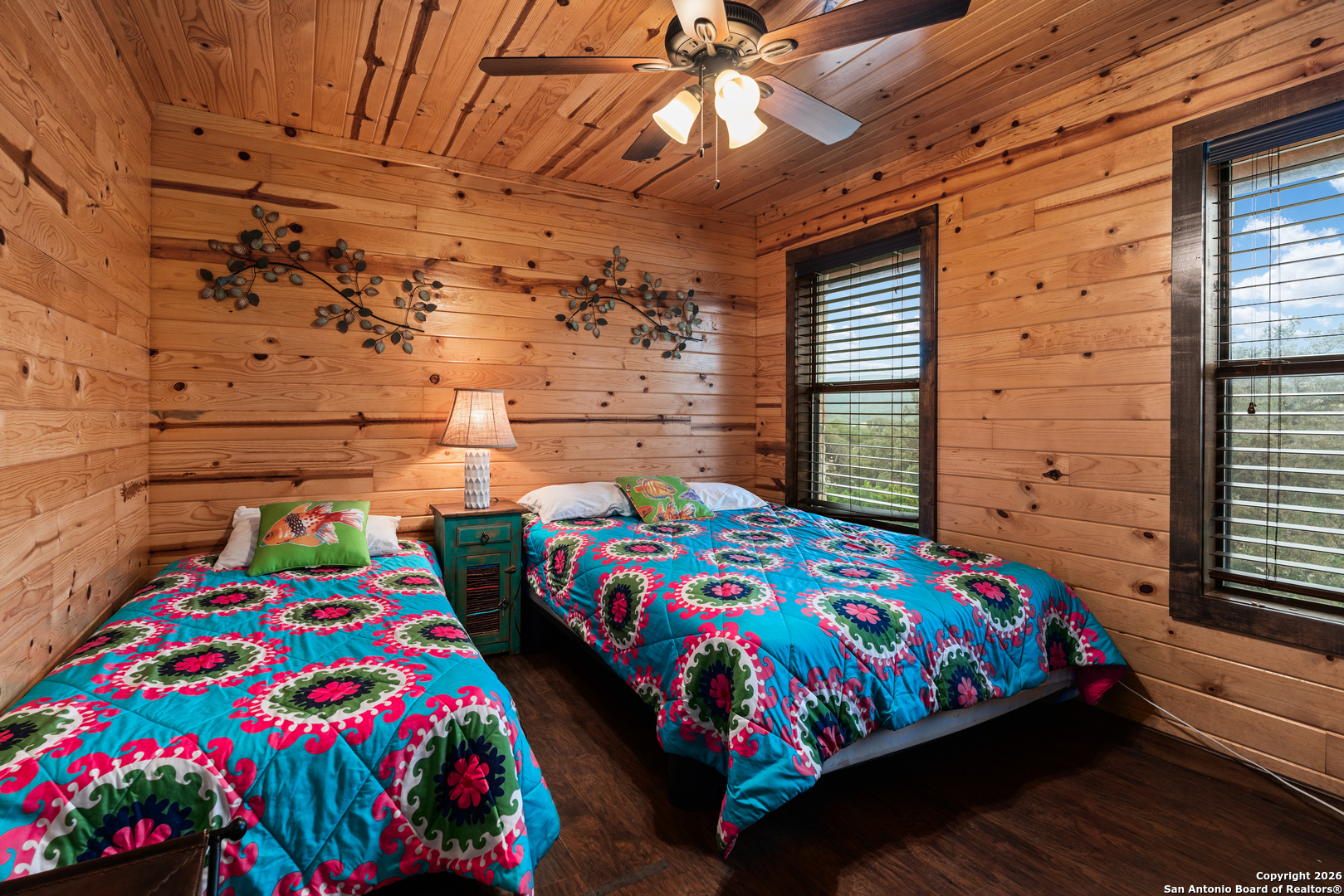 1539 River Road Concan, TX 78838 - Photo 32 of 45 a bedroom with a bed and a baby crib