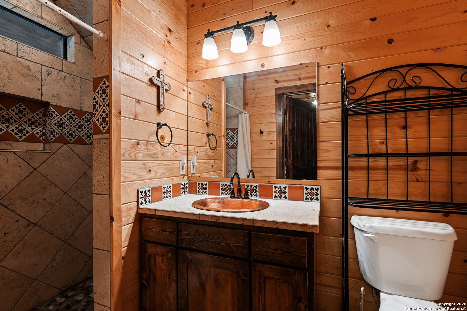 1539 River Road Concan, TX 78838 - Photo 34 of 45 a bathroom with a sink a toilet and shower