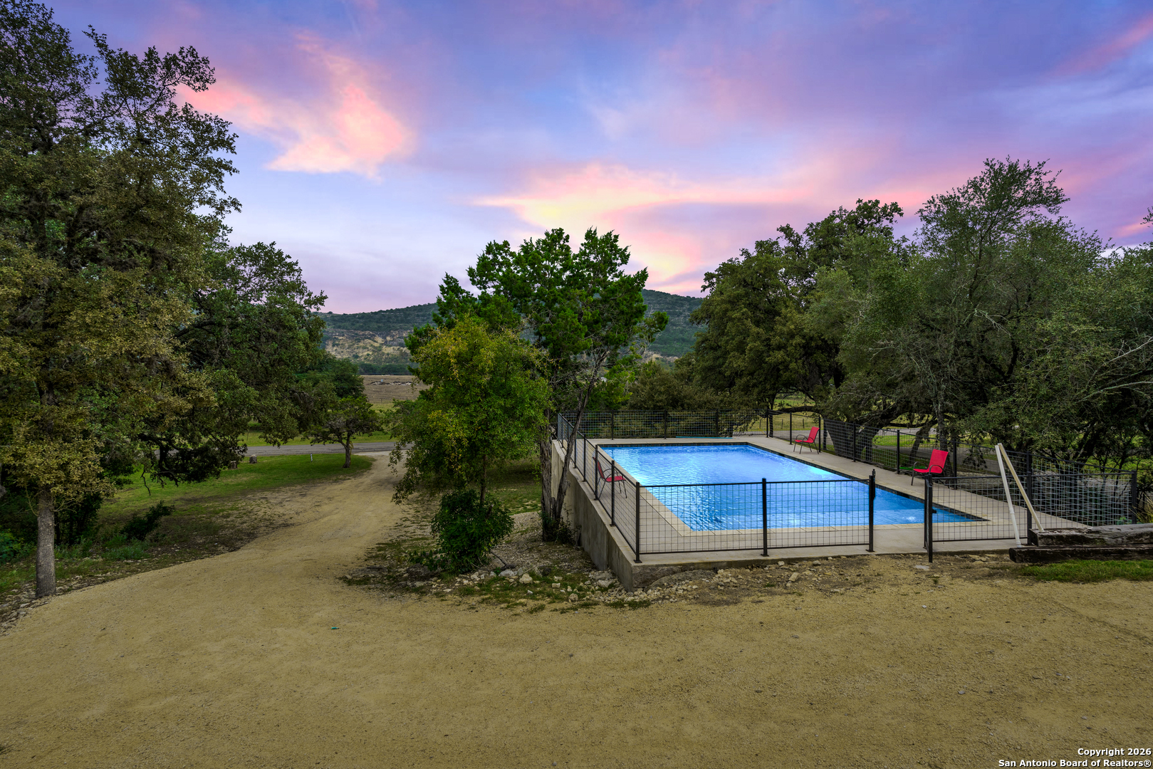 1539 River Road Concan, TX 78838 - Photo 40 of 45 a backyard of a house with table and chairs