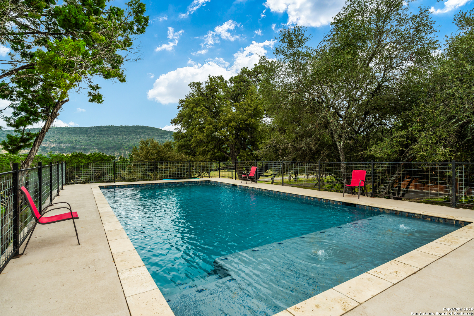 1539 River Road Concan, TX 78838 - Photo 43 of 45 a view of swimming pool with a yard