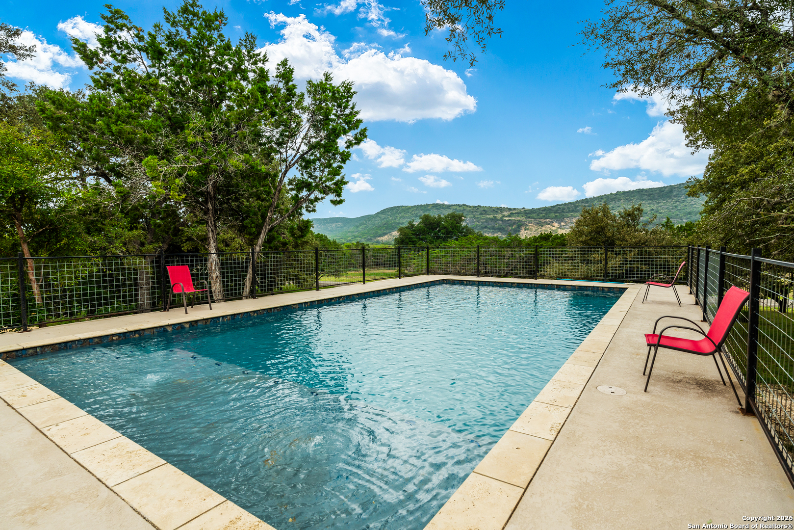 1539 River Road Concan, TX 78838 - Photo 44 of 45 swimming pool view with a lake view