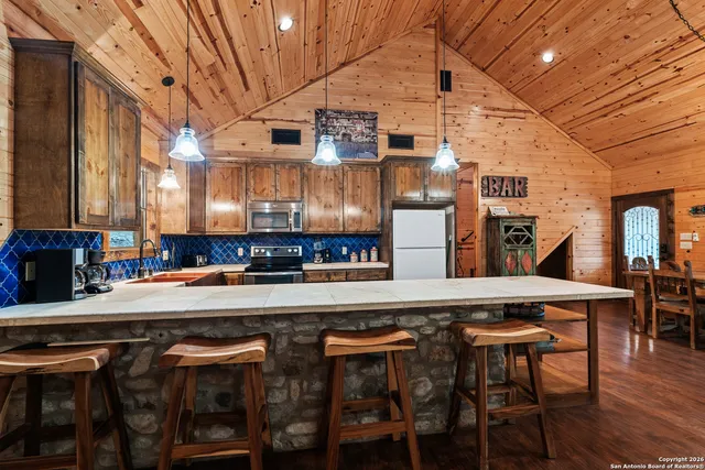 a kitchen with a table and chairs in it