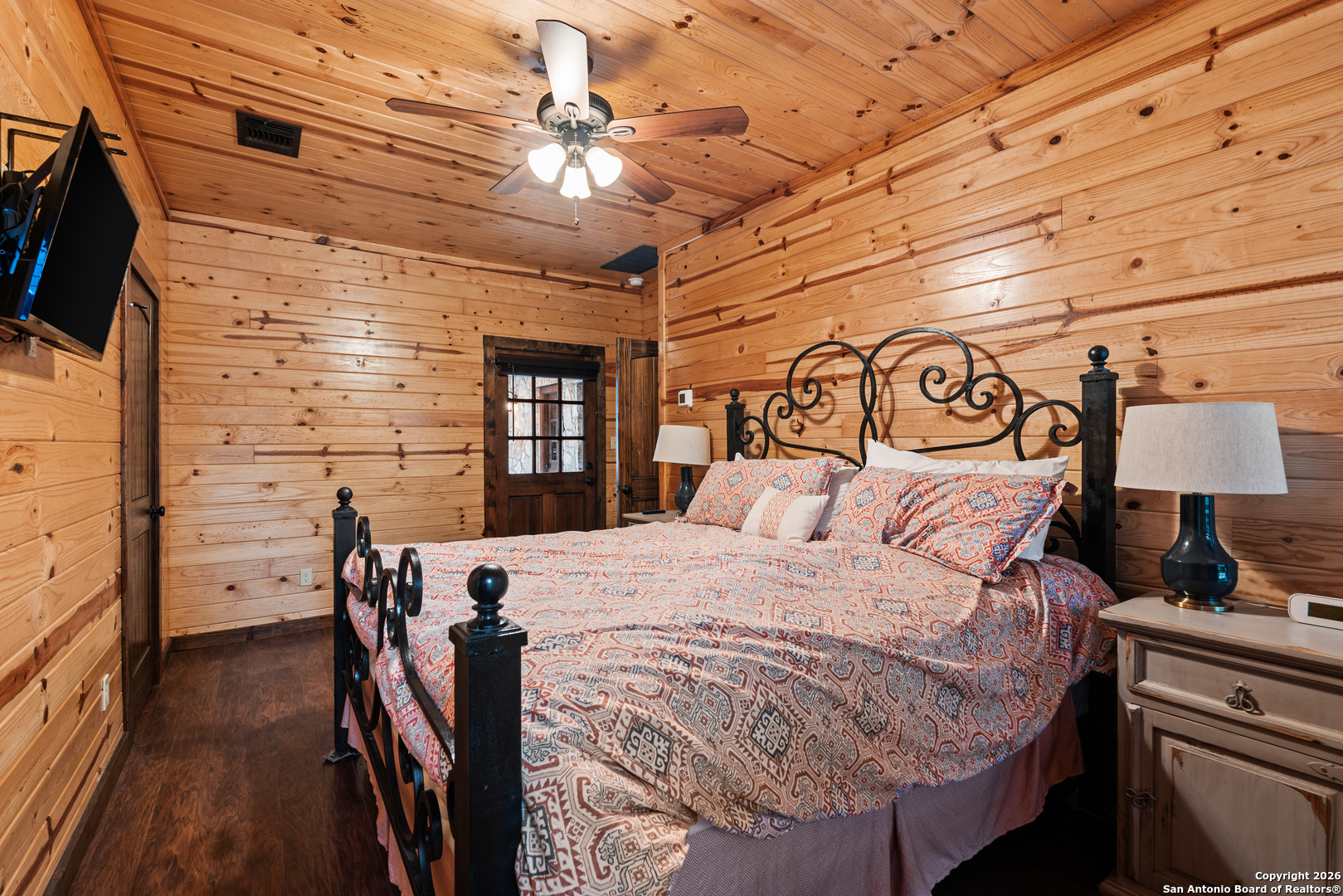 1539 River Road Concan, TX 78838 - Photo 10 of 45 a bed room with a bed and a television