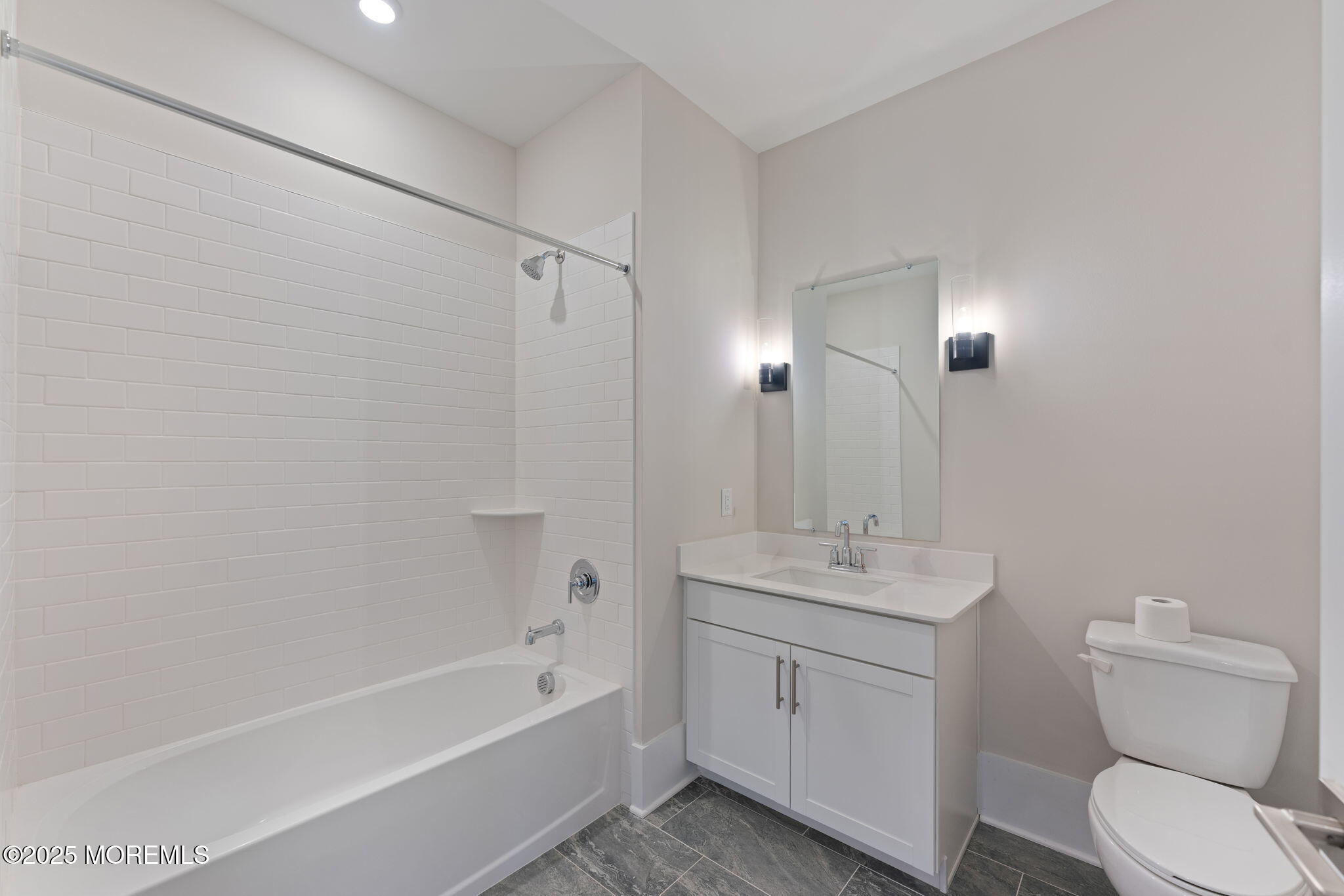 215 2nd Avenue, Unit 103 Asbury Park, NJ 07712 - Photo 13 of 33 a bathroom with a sink toilet and shower