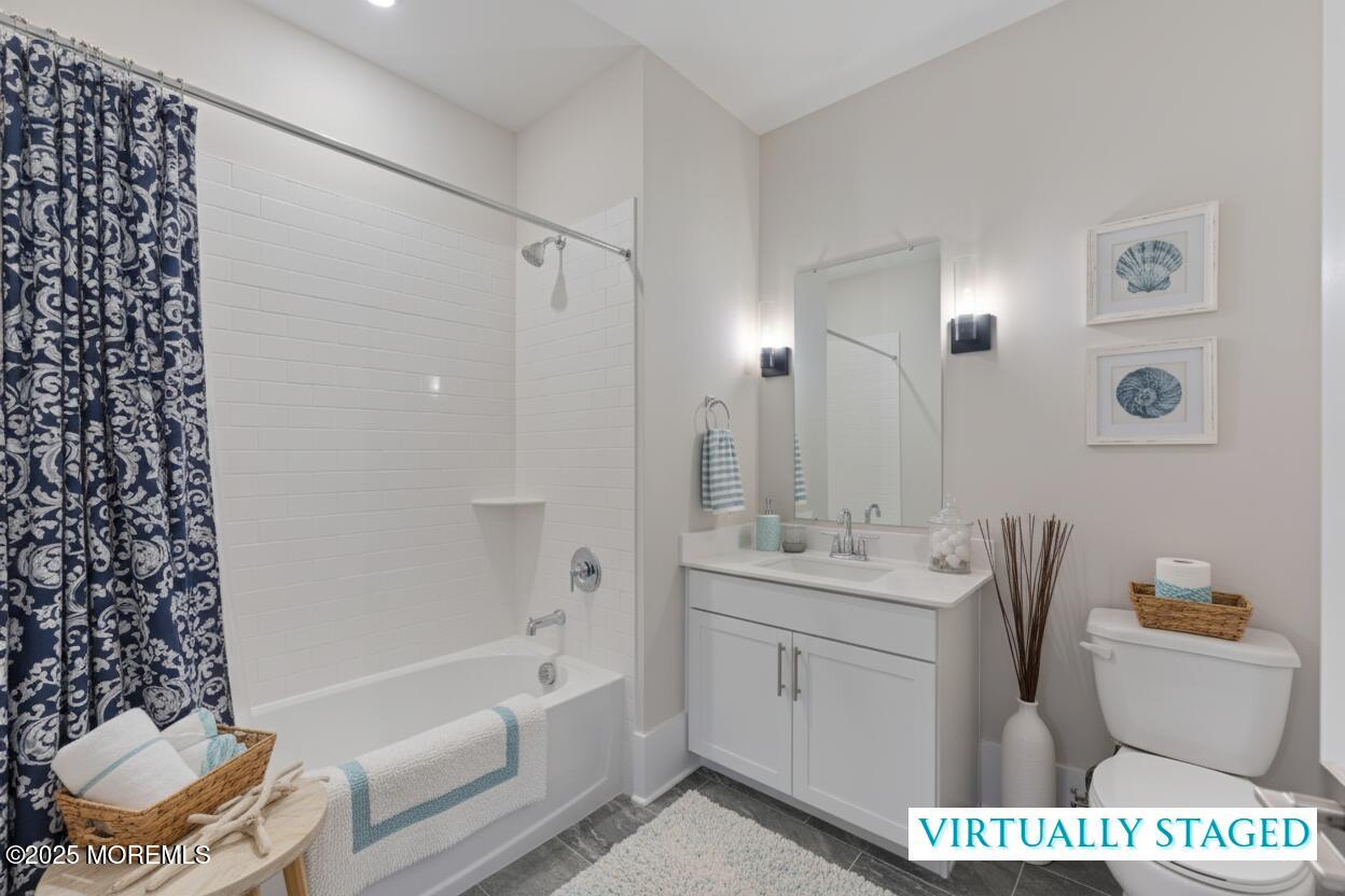 215 2nd Avenue, Unit 103 Asbury Park, NJ 07712 - Photo 14 of 33 a bathroom with a sink a toilet and shower