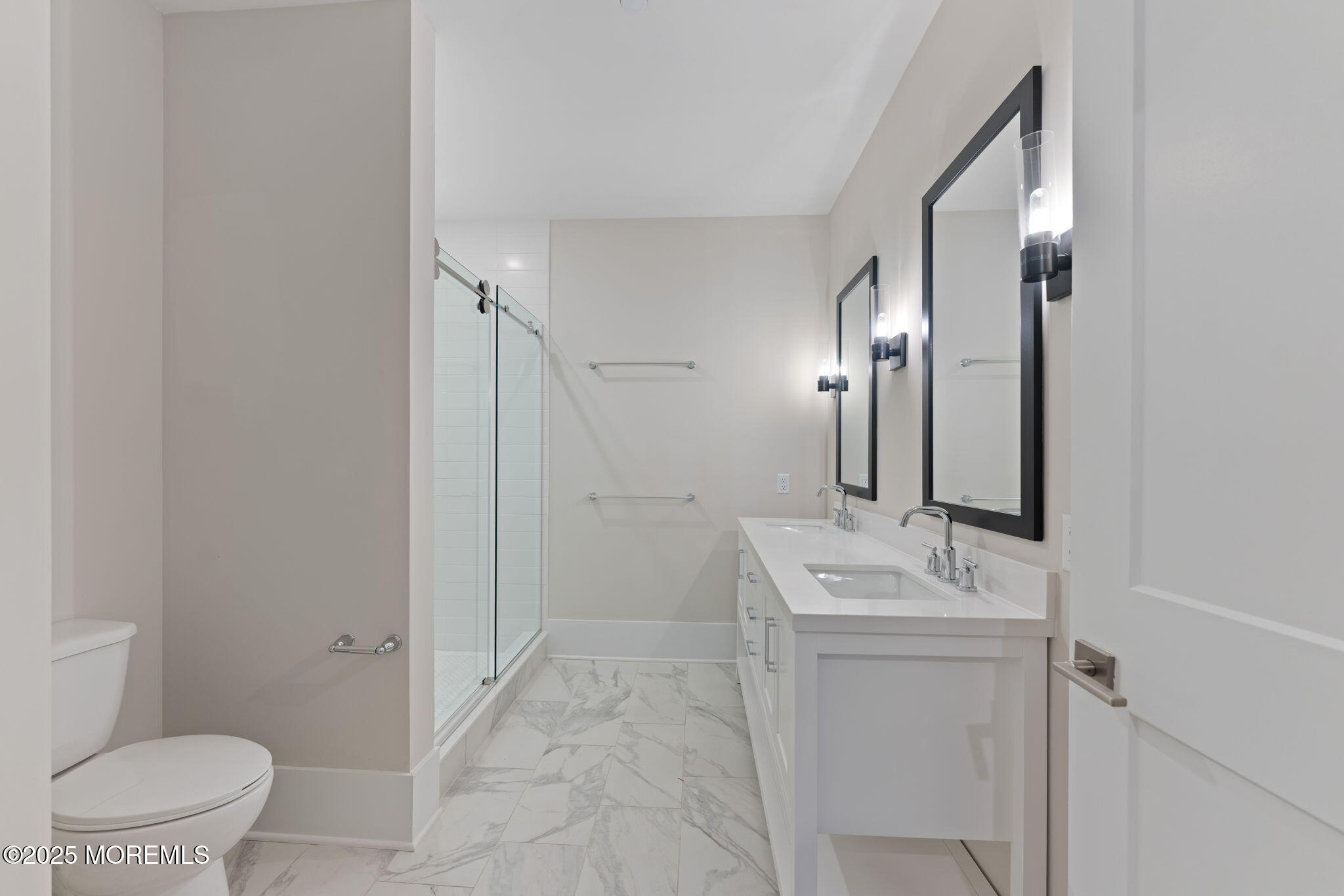 215 2nd Avenue, Unit 103 Asbury Park, NJ 07712 - Photo 17 of 33 a bathroom with a sink a toilet and a mirror