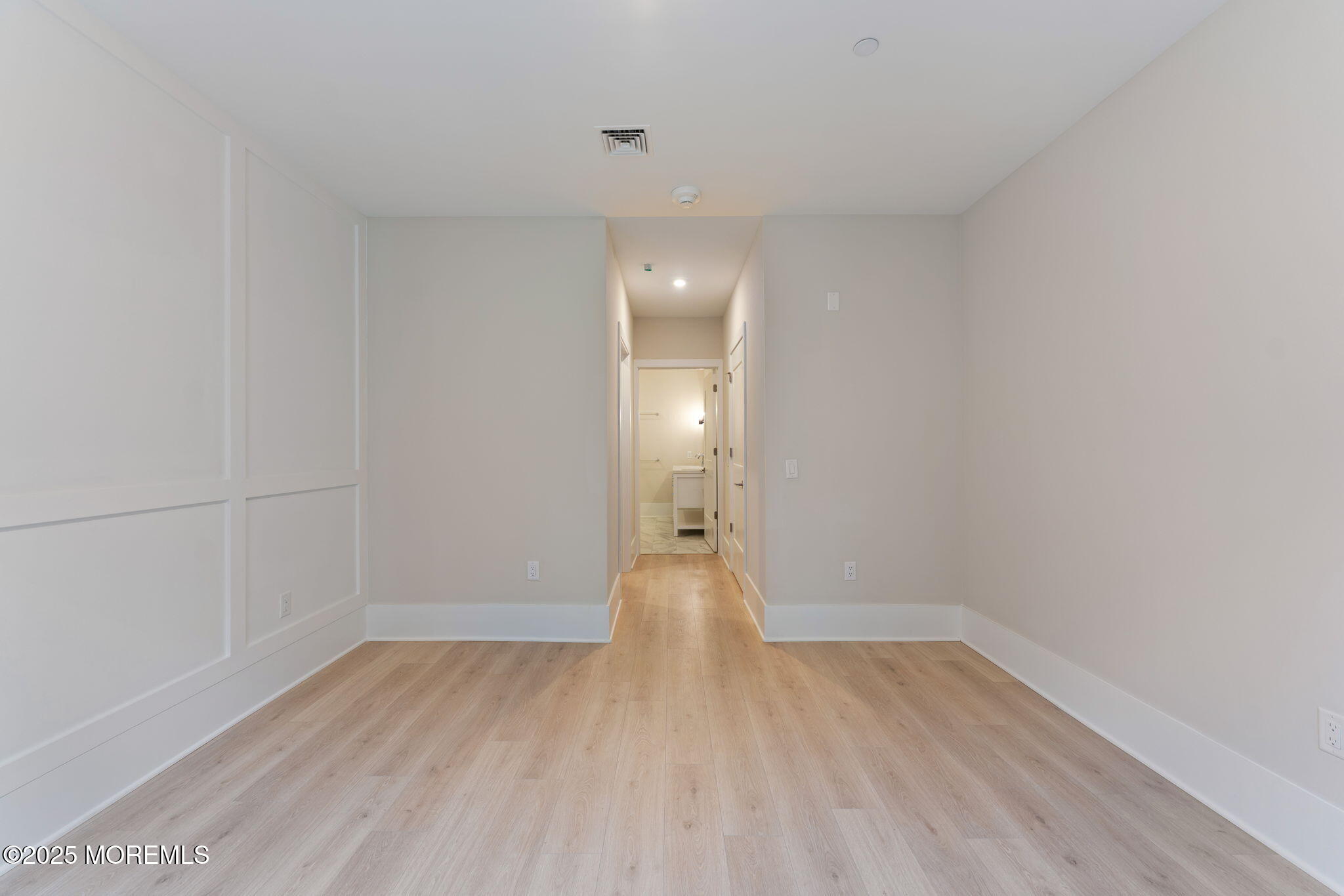 215 2nd Avenue, Unit 103 Asbury Park, NJ 07712 - Photo 23 of 33 a view of wooden floor and windows in an empty room