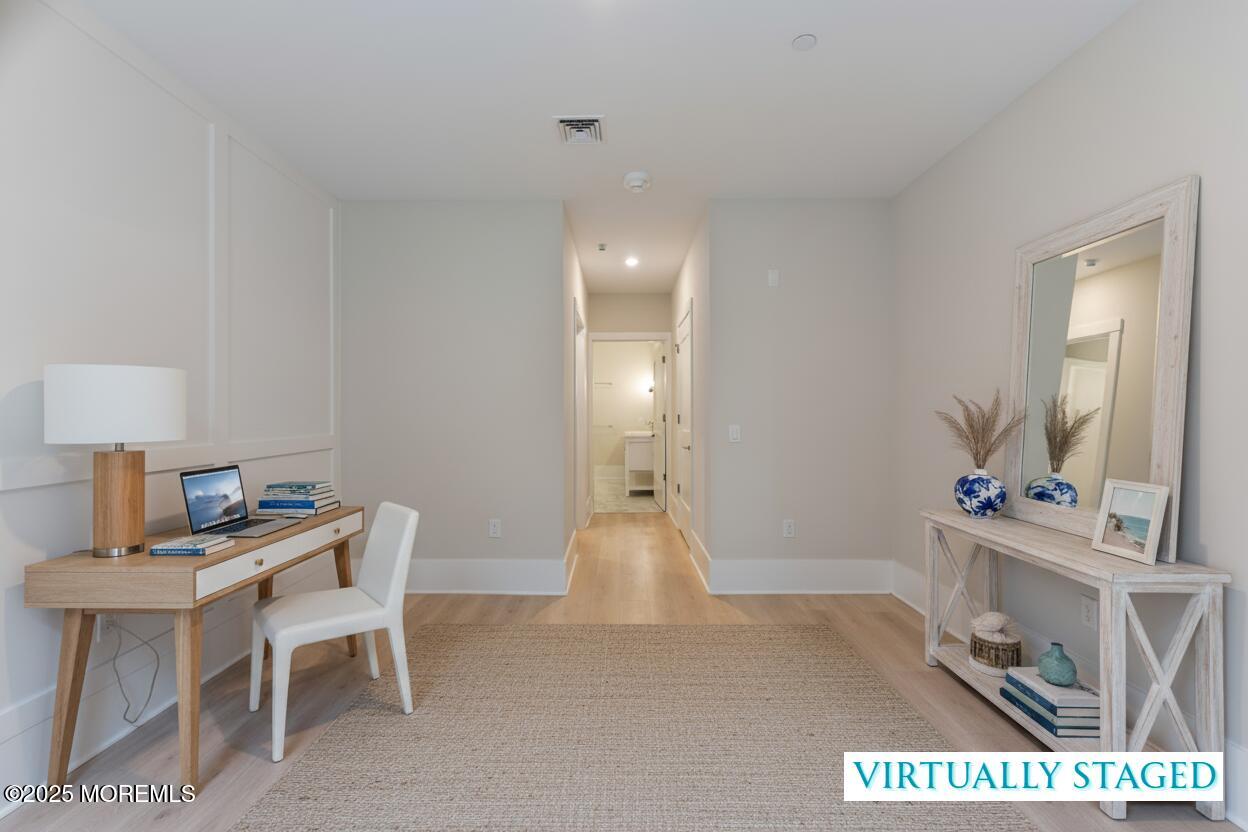 215 2nd Avenue, Unit 103 Asbury Park, NJ 07712 - Photo 24 of 33 a view of a room with furniture and wooden floor
