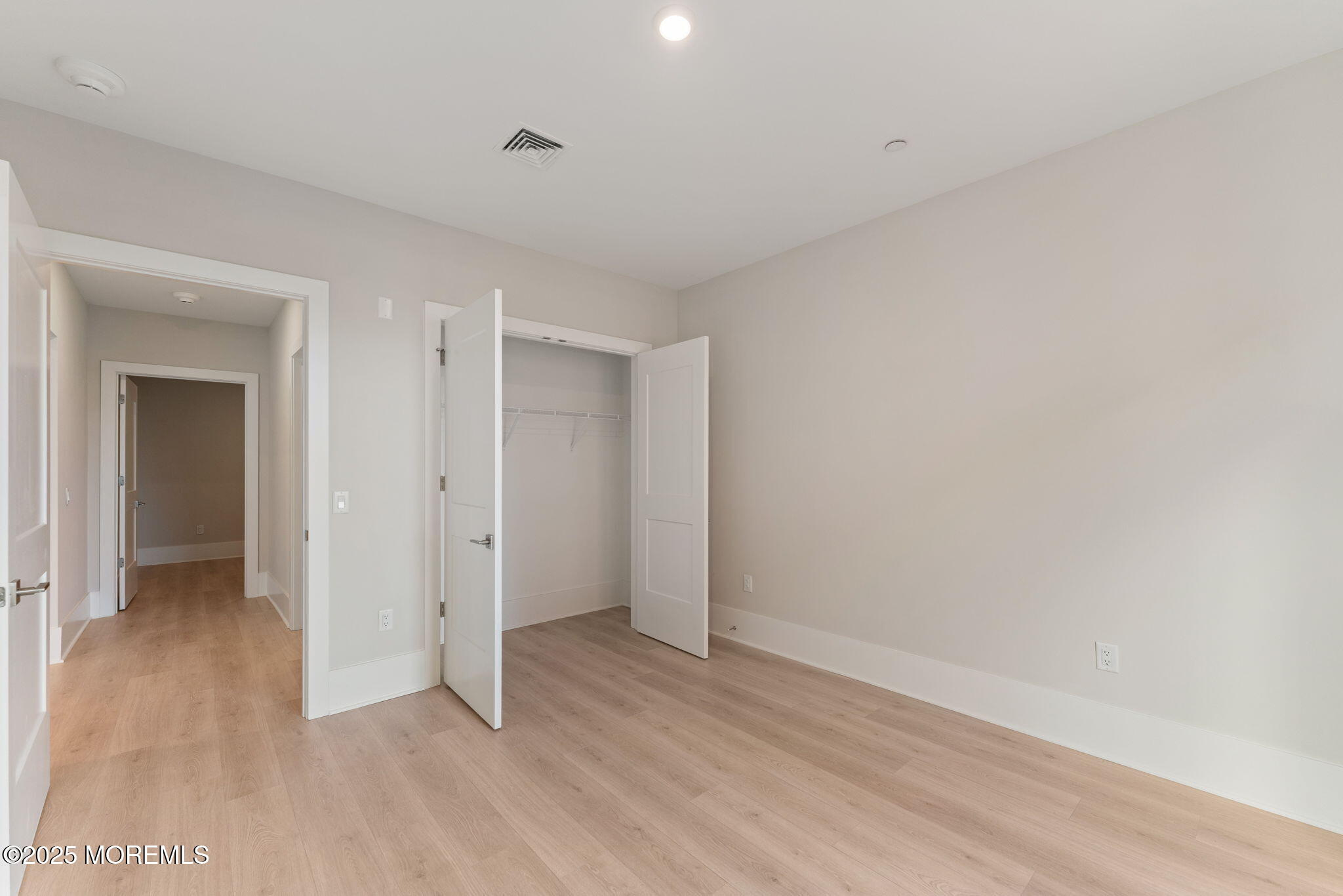 215 2nd Avenue, Unit 103 Asbury Park, NJ 07712 - Photo 10 of 33 wooden floor in an empty room