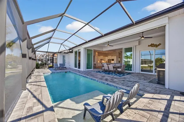 a view of a swimming pool with a patio