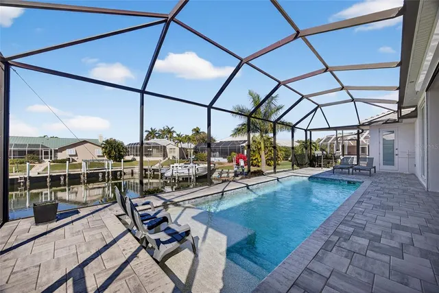 a view of a swimming pool with a lounge chair