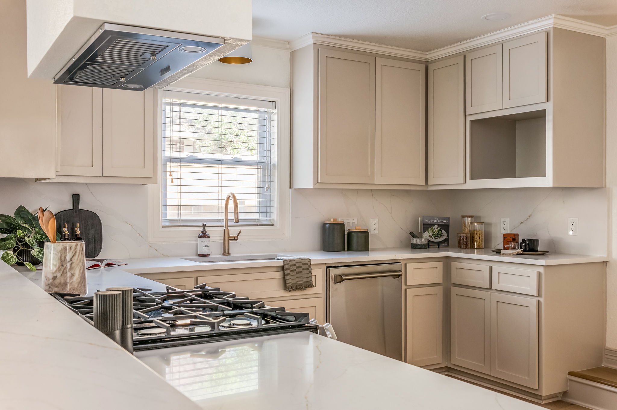 3801 Avenue H Austin, TX 78751 - Photo 17 of 40 a kitchen with stainless steel appliances granite countertop a sink stove and cabinets