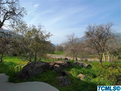 40131 Pierce Drive Three Rivers, CA 93271 - Photo 23 of 25 a view of a lake with houses in back