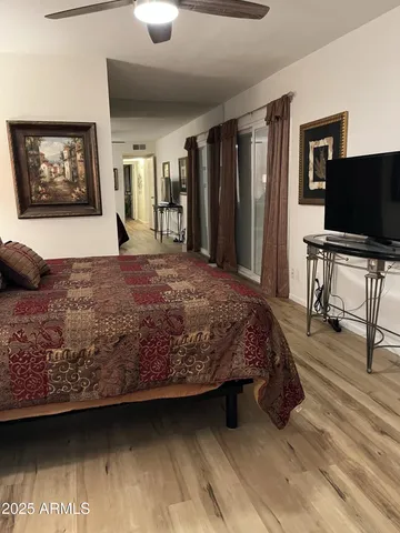 a bedroom with a bed and a dresser