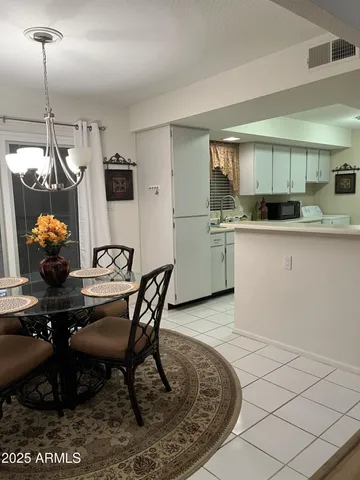a kitchen with sink a stove and refrigerator