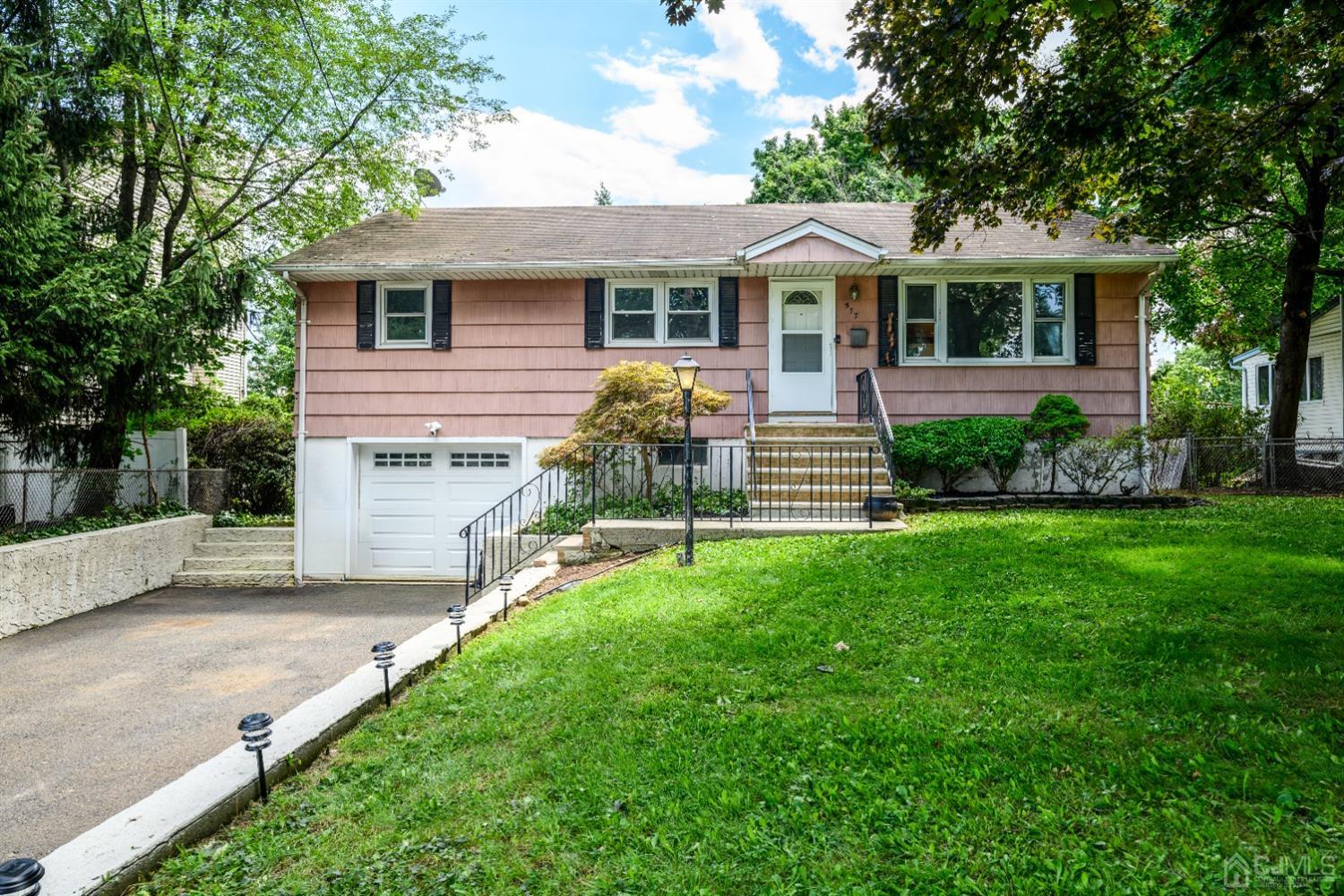 577 Old Post Road Edison, NJ 08817 - Photo 1 of 1 a front view of a house with a yard and green space