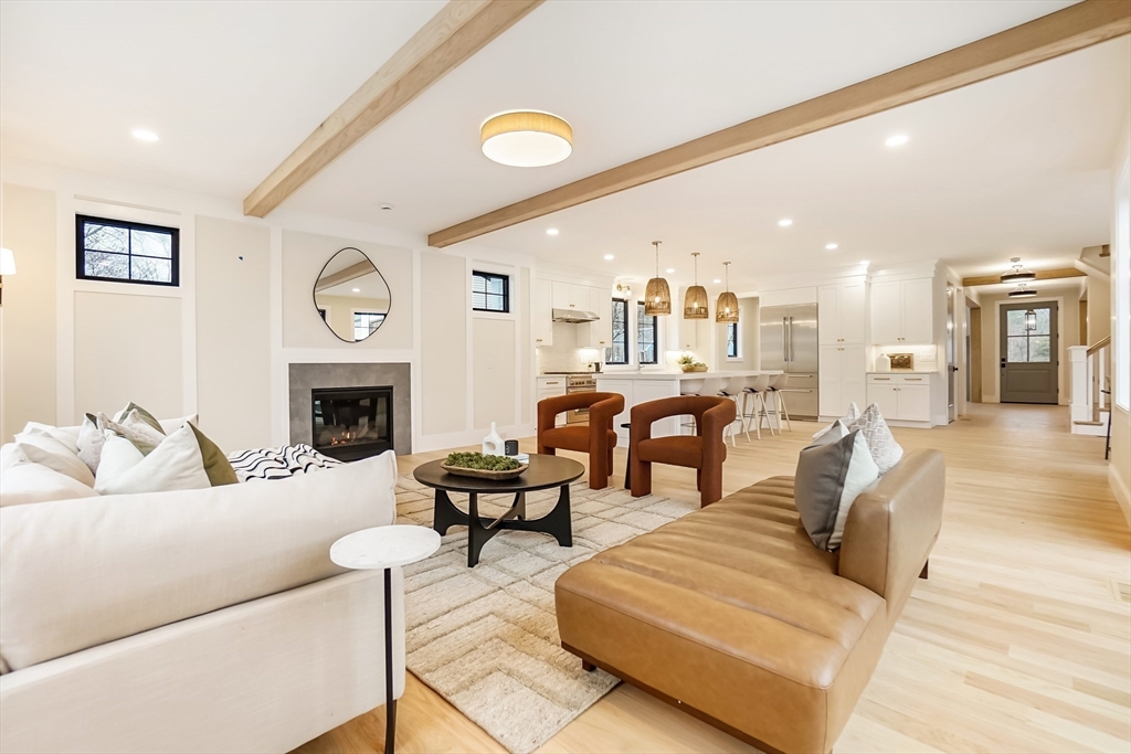 407 High Rock Street Needham, MA 02492 - Photo 14 of 36 a living room with furniture a clock and a fireplace