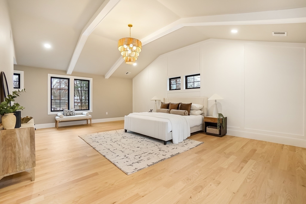 407 High Rock Street Needham, MA 02492 - Photo 15 of 36 a spacious bedroom with a bed a dresser and windows