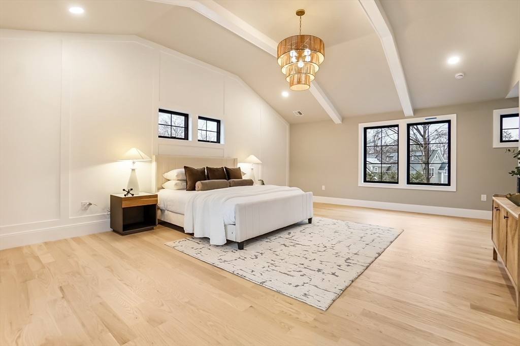407 High Rock Street Needham, MA 02492 - Photo 16 of 36 a spacious bedroom with a bed lamp and a dresser