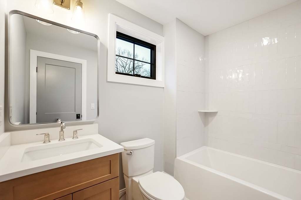 407 High Rock Street Needham, MA 02492 - Photo 21 of 36 a bathroom with a sink toilet and shower