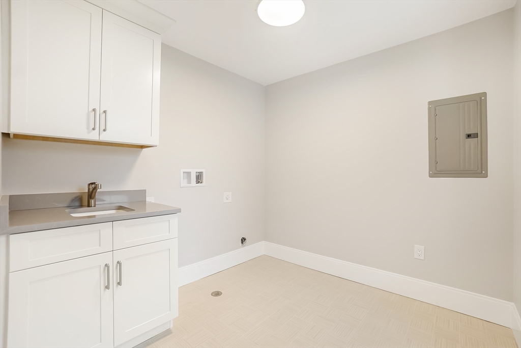 407 High Rock Street Needham, MA 02492 - Photo 25 of 36 a kitchen with a sink and cabinets