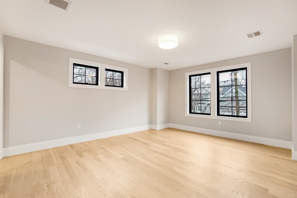 407 High Rock Street Needham, MA 02492 - Photo 26 of 36 a view of an empty room with a window