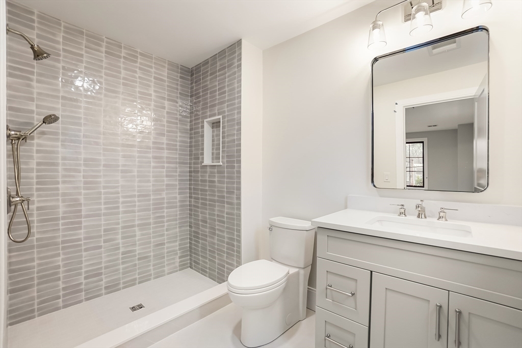 407 High Rock Street Needham, MA 02492 - Photo 28 of 36 a bathroom with a sink a toilet and shower