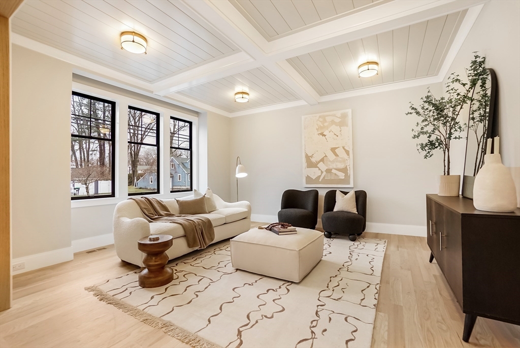 407 High Rock Street Needham, MA 02492 - Photo 4 of 36 a living room with furniture large window and a potted plant