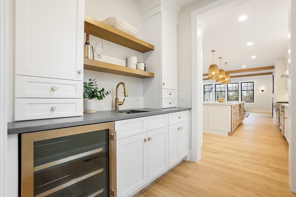 407 High Rock Street Needham, MA 02492 - Photo 7 of 36 a kitchen with cabinets and wooden floor