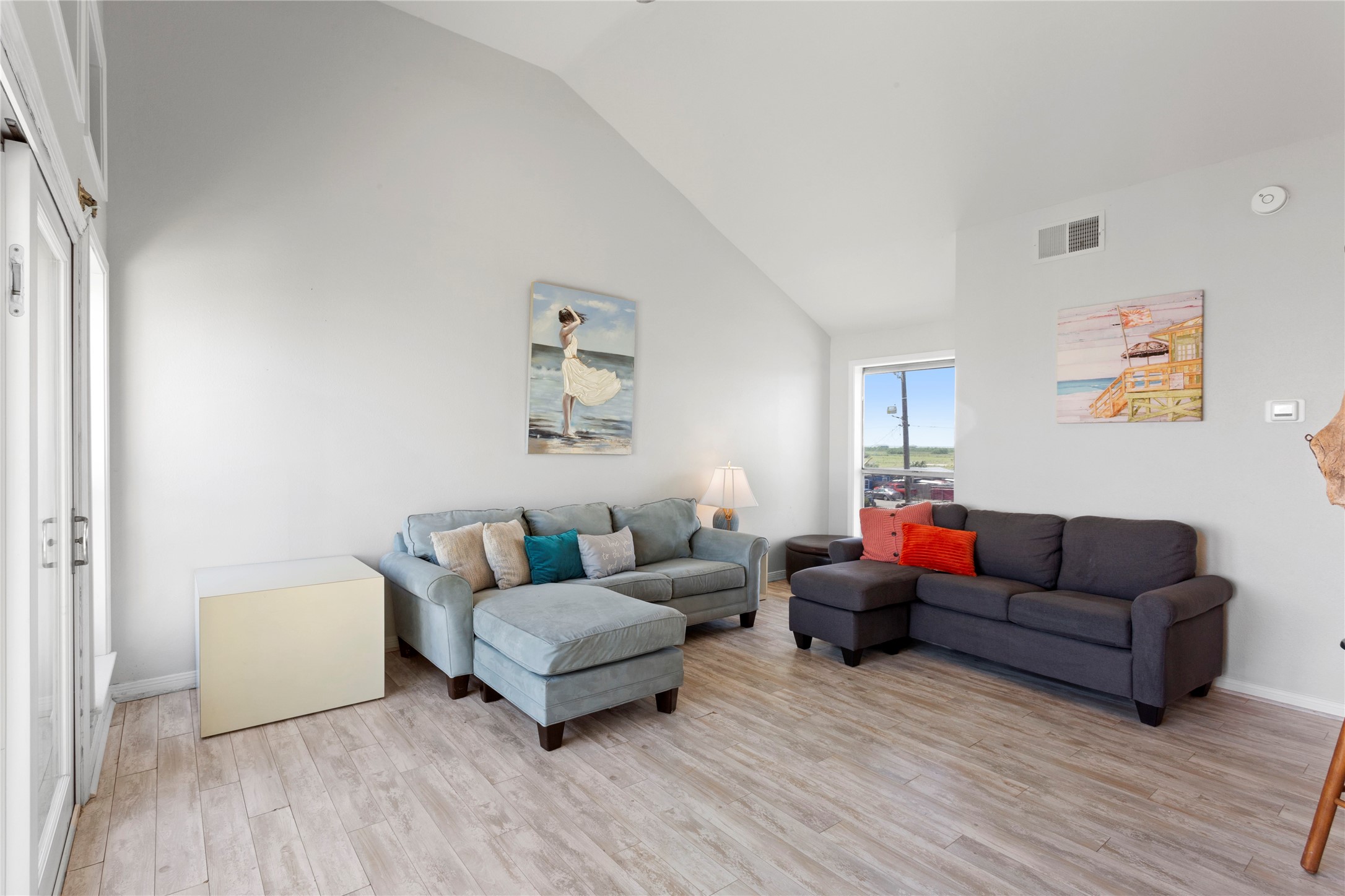 17627 Termini-San Luis Pass Road Galveston, TX 77554 - Photo 4 of 28 Experience the airy elegance of vaulted ceilings in this bright, inviting space. View of Galveston Bay from the window shown here. Additional storage closet adjacent to the window.