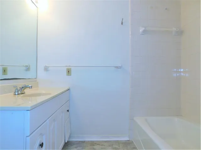 a bathroom with a sink and a bathtub