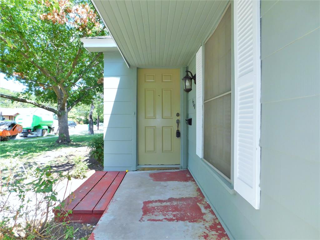 420 Fulton Street Denton, TX 76201 - Photo 3 of 23 a balcony with view of trees in the background