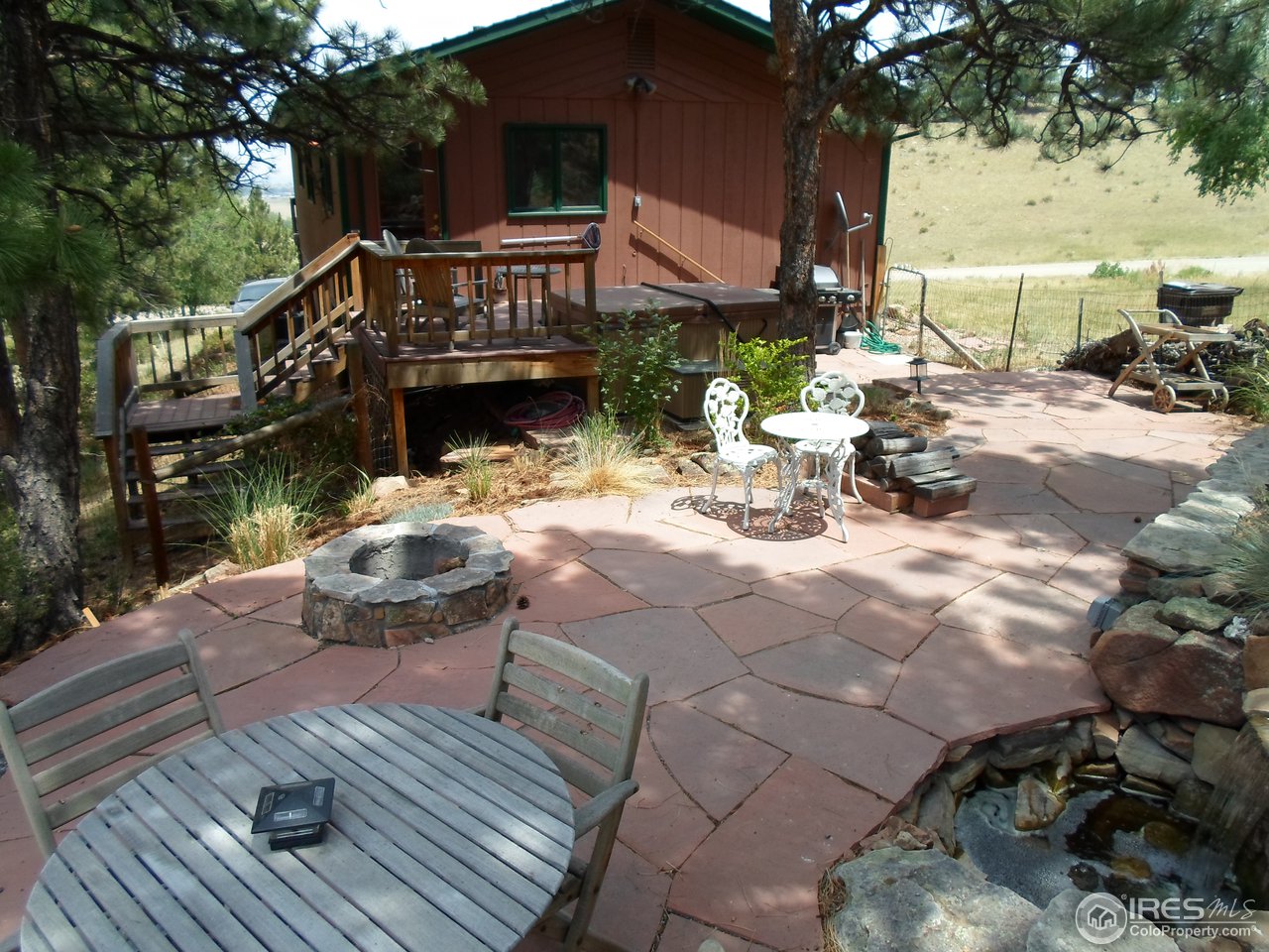 8443 Middle Fork Road Boulder, CO 80302 - Photo 4 of 12 Sandstone Patio with Water Feature, Fireplace, and